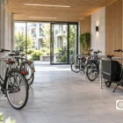 Parking vélo sécurisé pour bâtiment neuf avec espaces adaptés aux vélos cargos et VAE